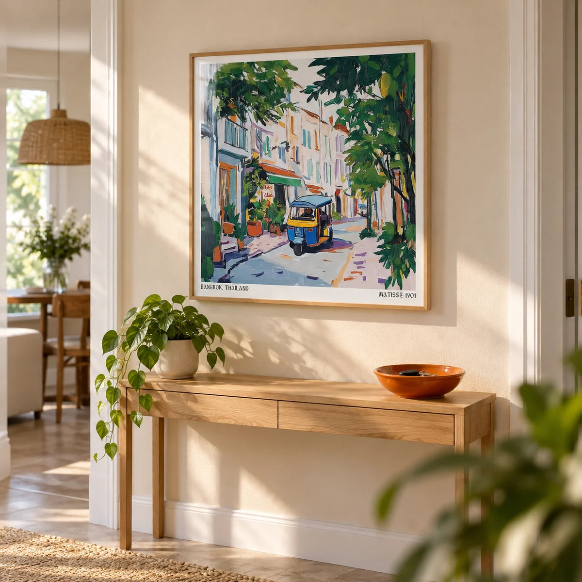 Holiday Prints, framed on the wall of a bright hallway with a warm beige wall
