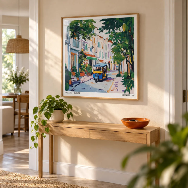 Holiday Prints, framed on the wall of a bright hallway with a warm beige wall
