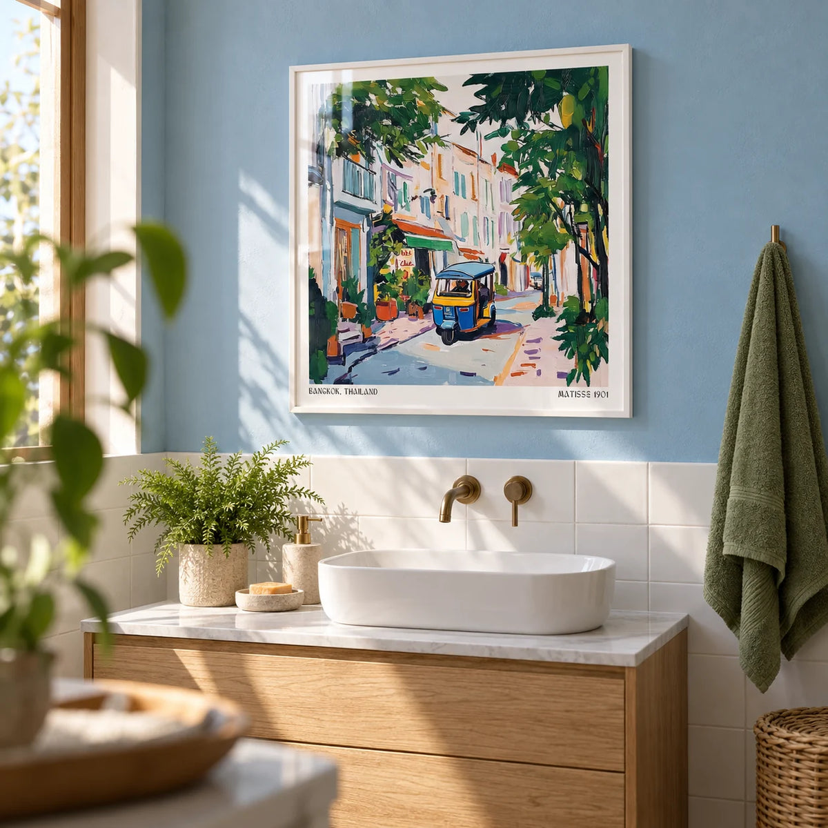 Holiday Prints, framed on the wall of a calm bathroom with a sky blue plaster wall and plain white tiles below
