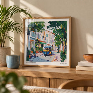 Holiday Prints, a small A4 framed print leaning on an oak shelf in a living room