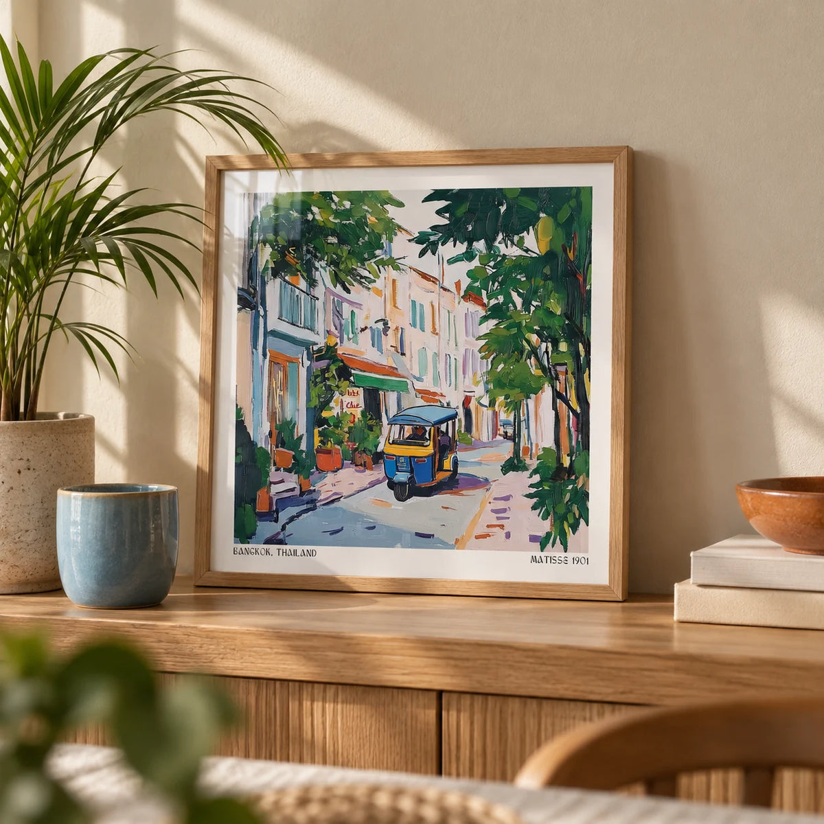 Holiday Prints, a small A4 framed print leaning on an oak shelf in a living room
