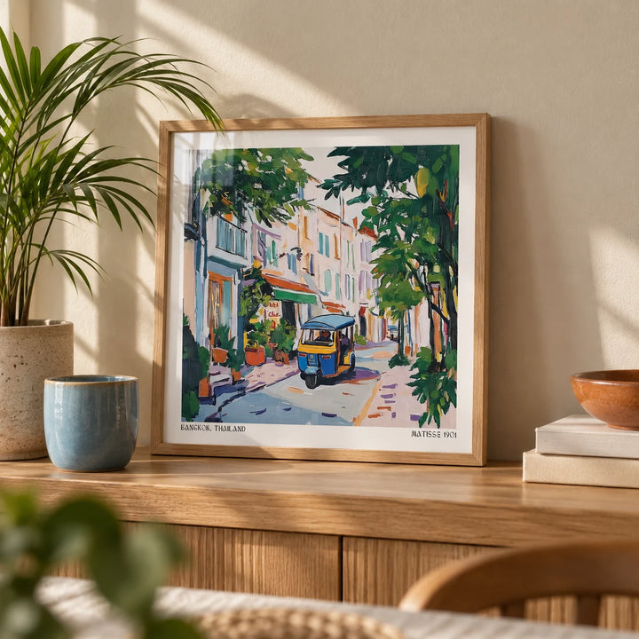 Holiday Prints, a small A4 framed print leaning on an oak shelf in a living room