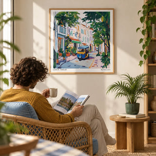 Holiday Prints, framed on the wall of a sunny reading corner with a warm white wall in a living room