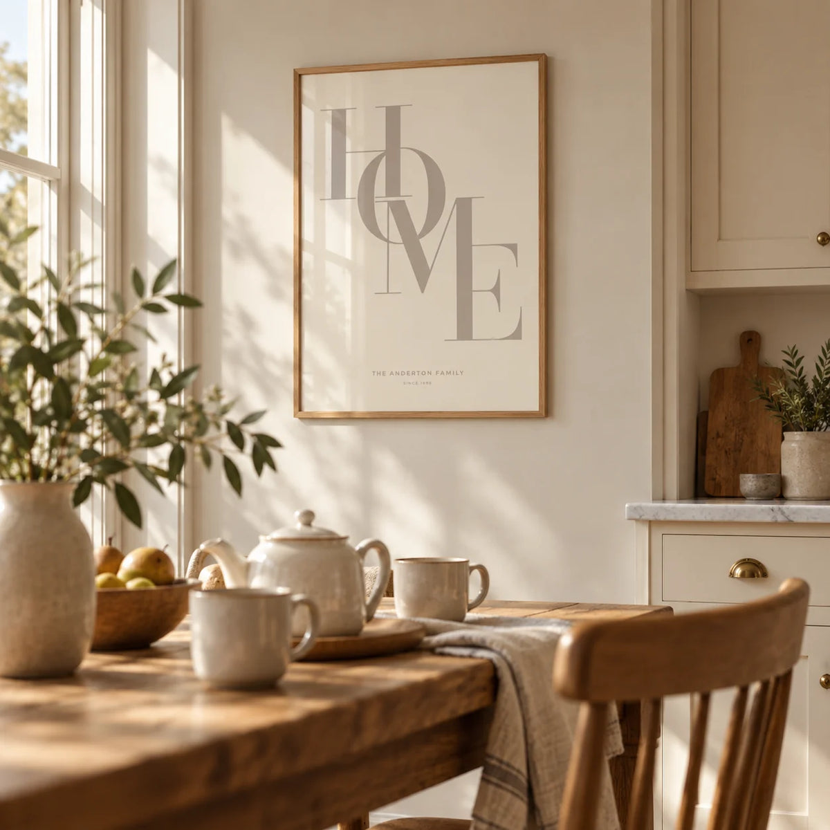 Home Beige Personal Print, framed on the wall of a warm family kitchen with cream cabinets