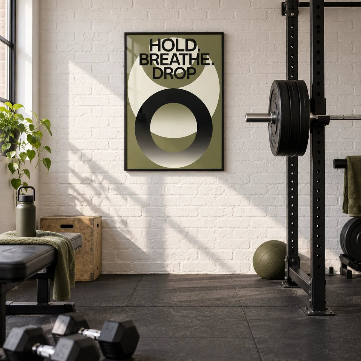 Home Gym Wall Art, framed on the wall of a converted garage home gym with a white painted brick wall and black rubber flooring