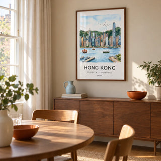 Hong Kong Skyline Art Print, framed on the wall of a relaxed dining room in a UK flat with a warm beige wall and a broad sash window
