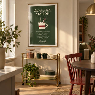 Hot Chocolate Station Print, framed on the wall of a small open-plan dining area in a modern UK flat with a warm cream wall and a pale oak floor
