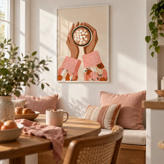 Hot Cocoa Wall Art, framed on the wall of a cosy breakfast nook with a white wall in a kitchen