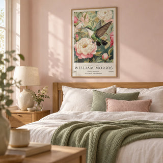 Hummingbird Prints, framed on the wall of a soft bedroom with a pale blush pink wall