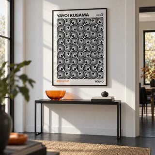 Hypnotic Wall Art, framed on the wall of a crisp hallway with a white wall and a plain black floor