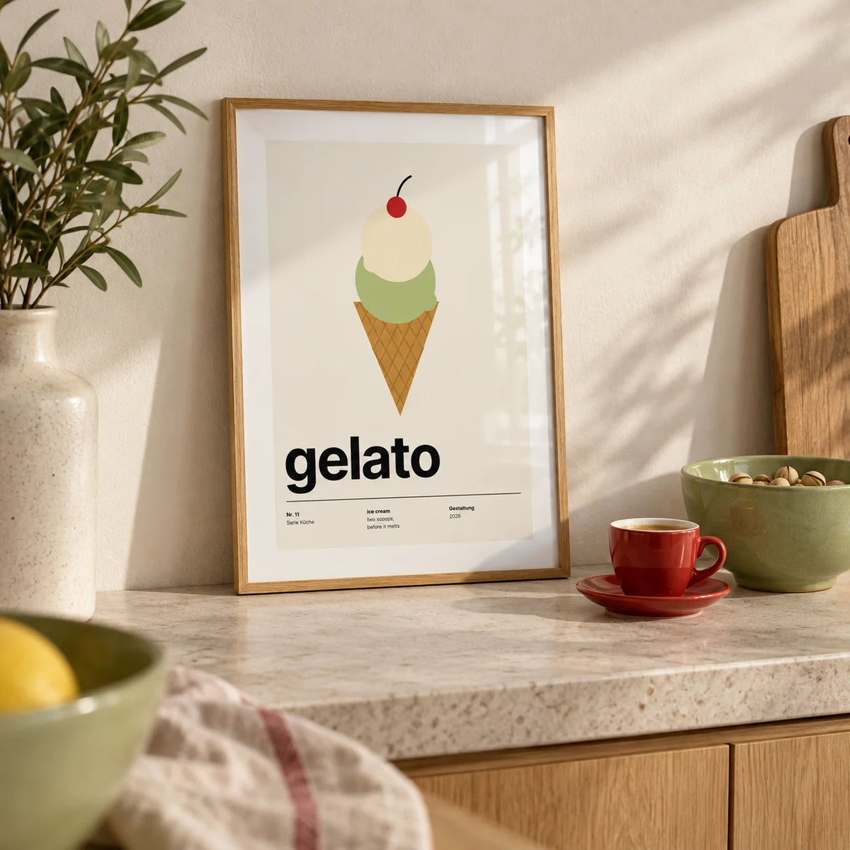 Ice Cream Poster, a small A4 framed print leaning on a pale stone kitchen worktop