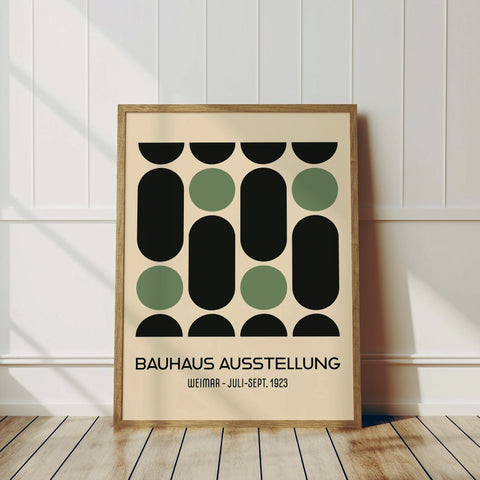 Green and black Bauhaus poster displayed in a room