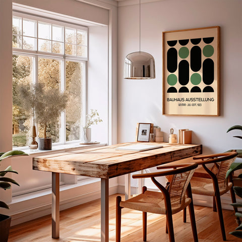 Green and black Bauhaus poster in a dining room