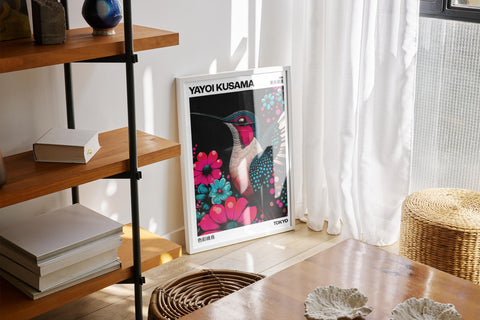 Large colorful wall art featuring a hummingbird and floral elements.