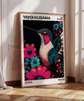 Hummingbird print with colorful flowers on black background.