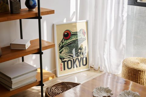 Frog poster with red eyes and Tokyo backdrop.