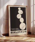 Big art black Bauhaus poster design with stacked stones.