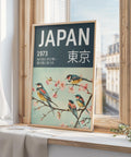 Teal-green Japanese wall art featuring birds and cherry blossoms.