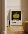 Yellow and black polka dot wall art by Yayoi Kusama for bedroom or office.