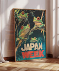 Colorful bold Japan Week frog poster featuring Japanese tree frogs.