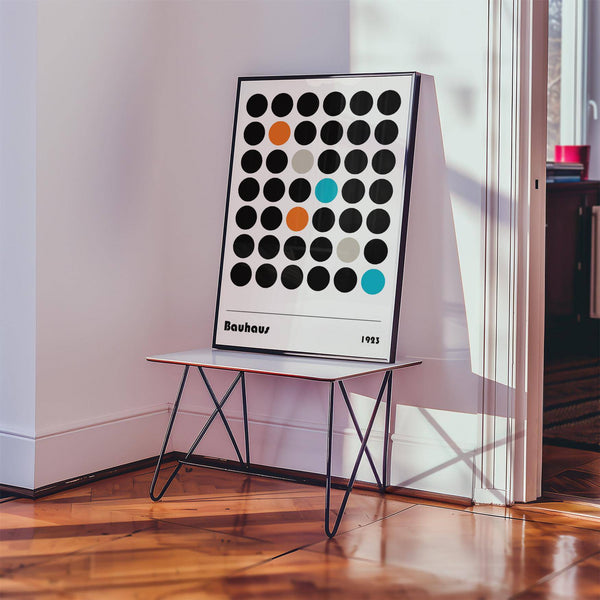 Minimalist graphic prints inspired by Bauhaus 1923 dots in black and orange tones