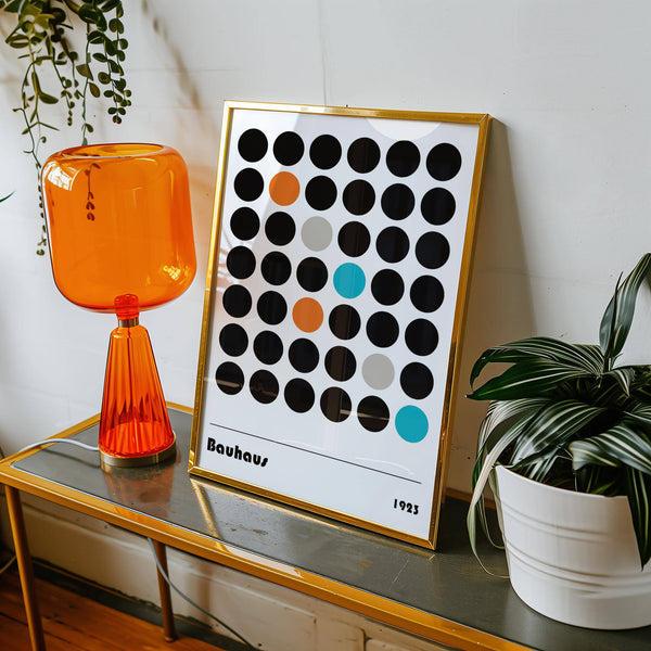 Bauhaus-inspired graphic prints featuring geometric dots in teal and orange for modern living rooms