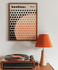 Geometric orange dot pattern wall art.