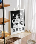 Black-and-white Maneki Neko fortune cat, Japanese decor.