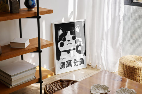 Black-and-white Maneki Neko fortune cat, Japanese decor.