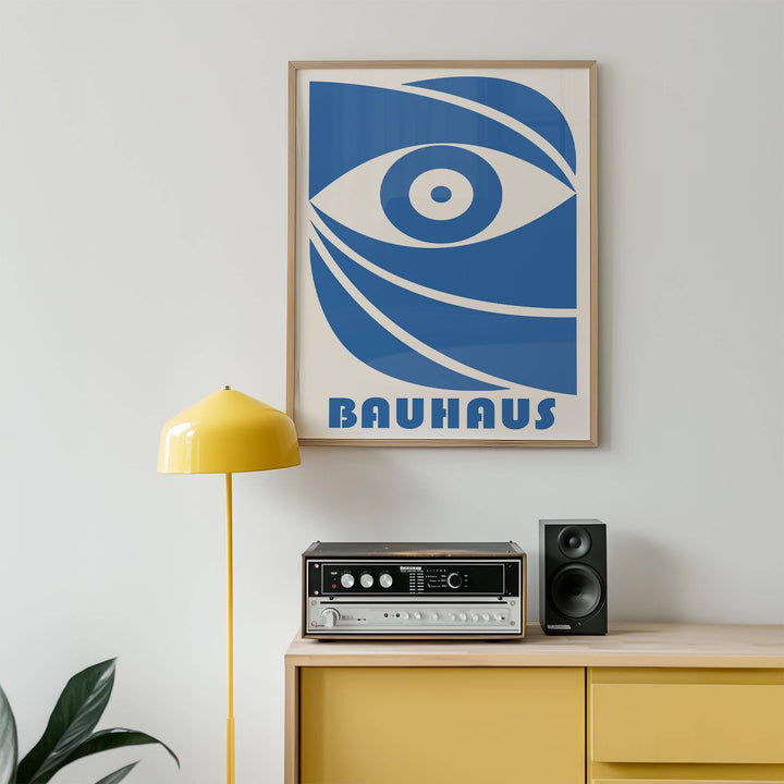 Bauhaus framed print of a stylised blue eye above a radio and next to a yellow lamp
