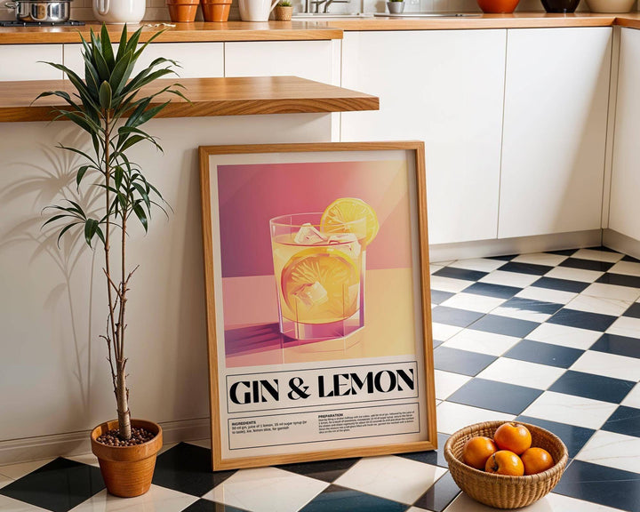 Bar wall decor of a gin and lemon cocktail illustration leaning on kitchen floor near a potted plant and basket of oranges