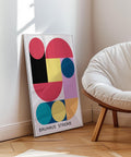 Colourful Bauhaus wall art with geometric shapes.