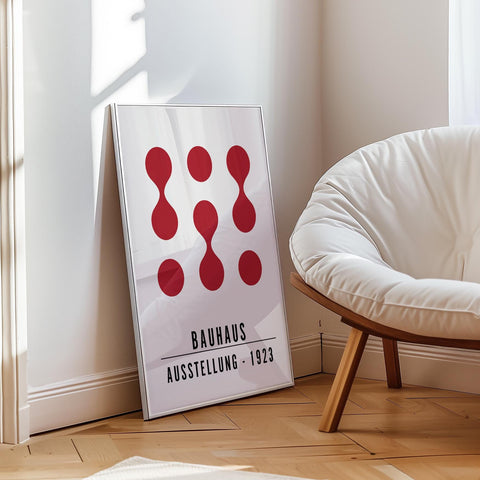 Red Bauhaus-inspired art with circles and hourglass shapes