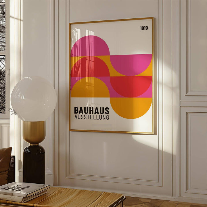 Large Artwork for Walls with pink red and orange semi-circles in a sunlit room with a lamp