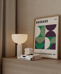 Retro Bauhaus wall art with green and purple shapes