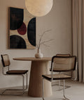 Abstract circle design in earthy tones with red accent