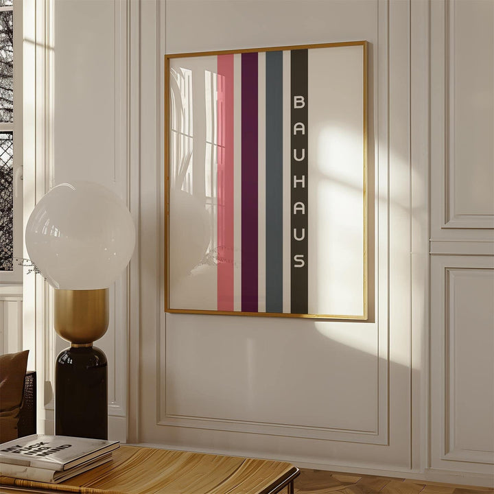 Geometric Art Wall print with vertical coloured stripes in a gold frame hung on a white wall with mouldings