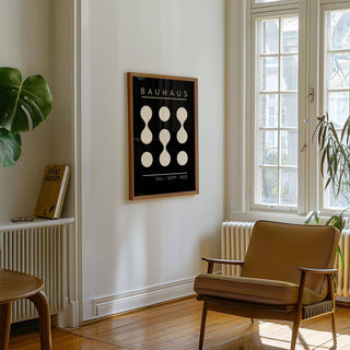 Framed black and white geometric art with circular patterns