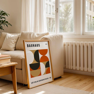 Office wall decor with earthy black, orange, and gold tones