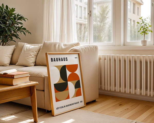 Office wall decor with earthy black, orange, and gold tones