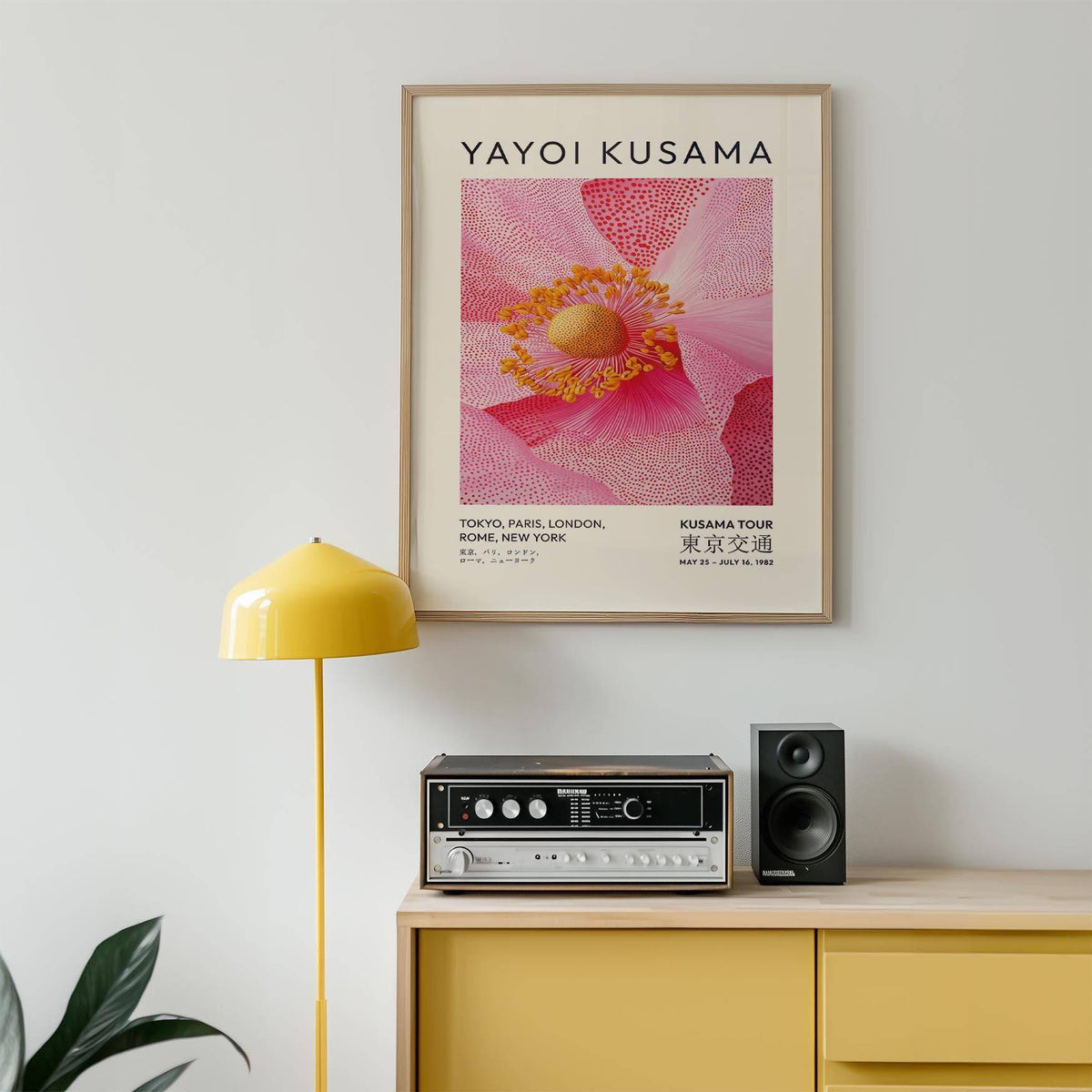 Bright pink floral wall art framed in creative studio space