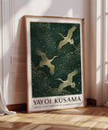 Golden crane bird wall art on green background.