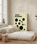 Modern Japanese poster with bold black polka dots on a neutral background.