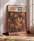 Majestic tiger surrounded by red chrysanthemums in a Japanese-inspired woodblock design.