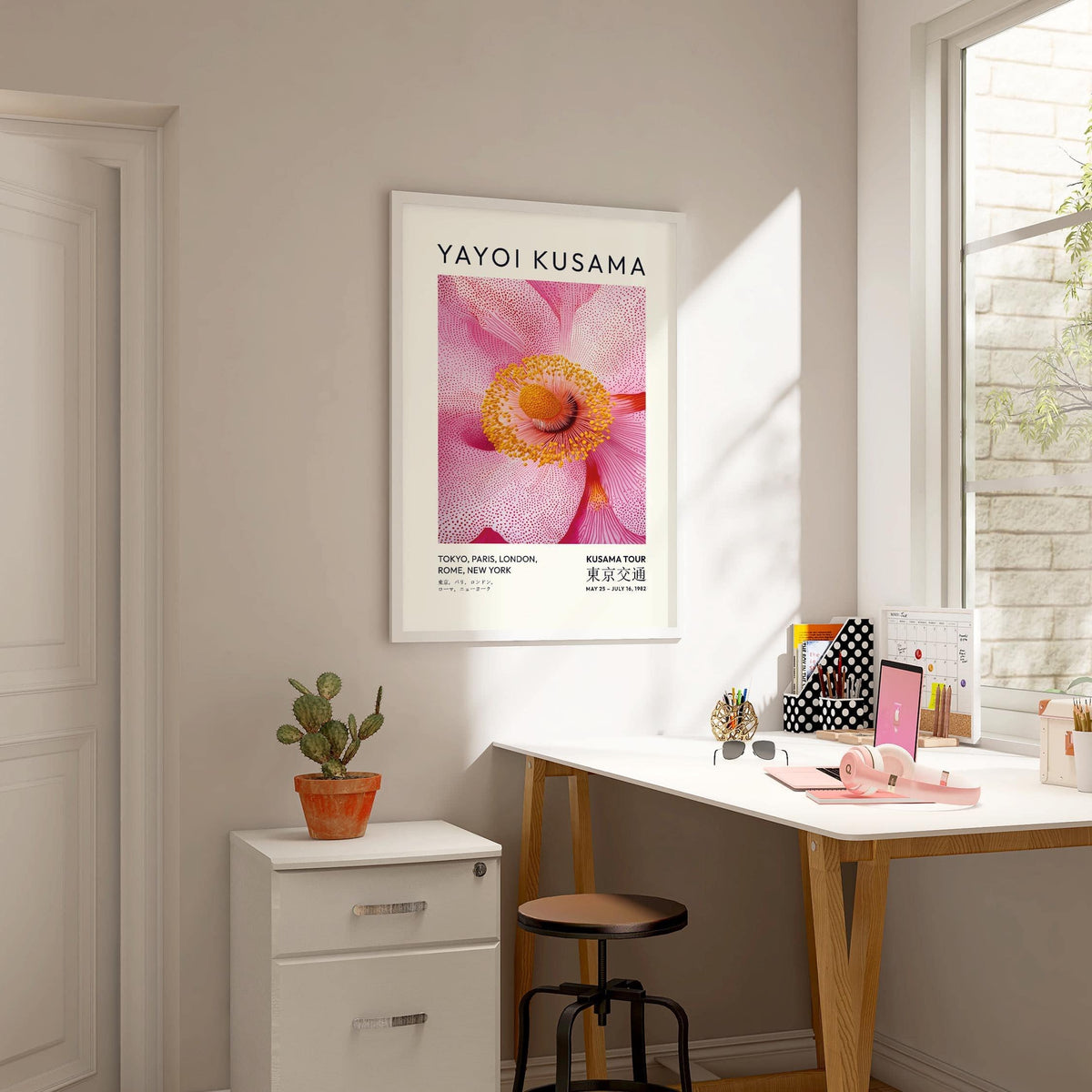 Colourful floral details featured on abstract pink wall art piece