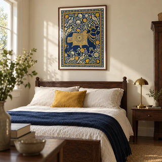 Indian Art Print, framed on the wall of a restful bedroom in a characterful UK home with warm cream walls and dark wooden furniture
