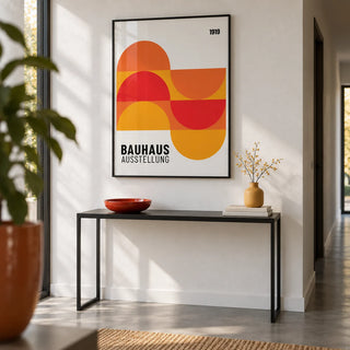 Inexpensive Artwork, framed on the wall of a crisp hallway with a white wall and a plain grey floor