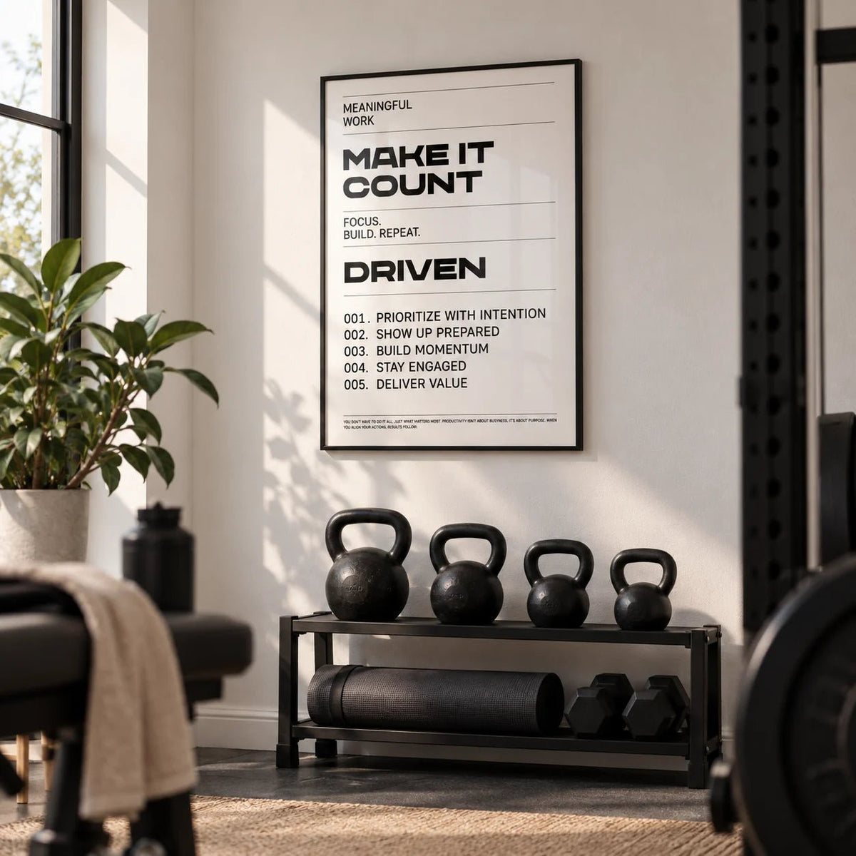 Inspiration Quotes Wall Art, framed on the wall of a small home gym