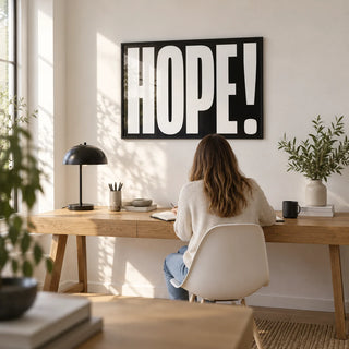 Inspirational Artwork, framed on the wall of a bright home office with a white wall