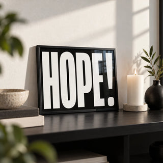 Inspirational Artwork, a small A4 framed print leaning on a black shelf in a living room